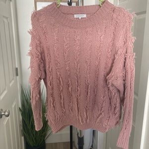 Medium knit sweater(Fits more like a small). A cute unique light weight sweater.